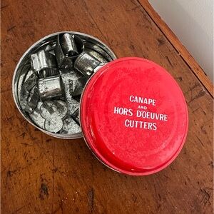 Metal box of Hors d’œuvres cutters